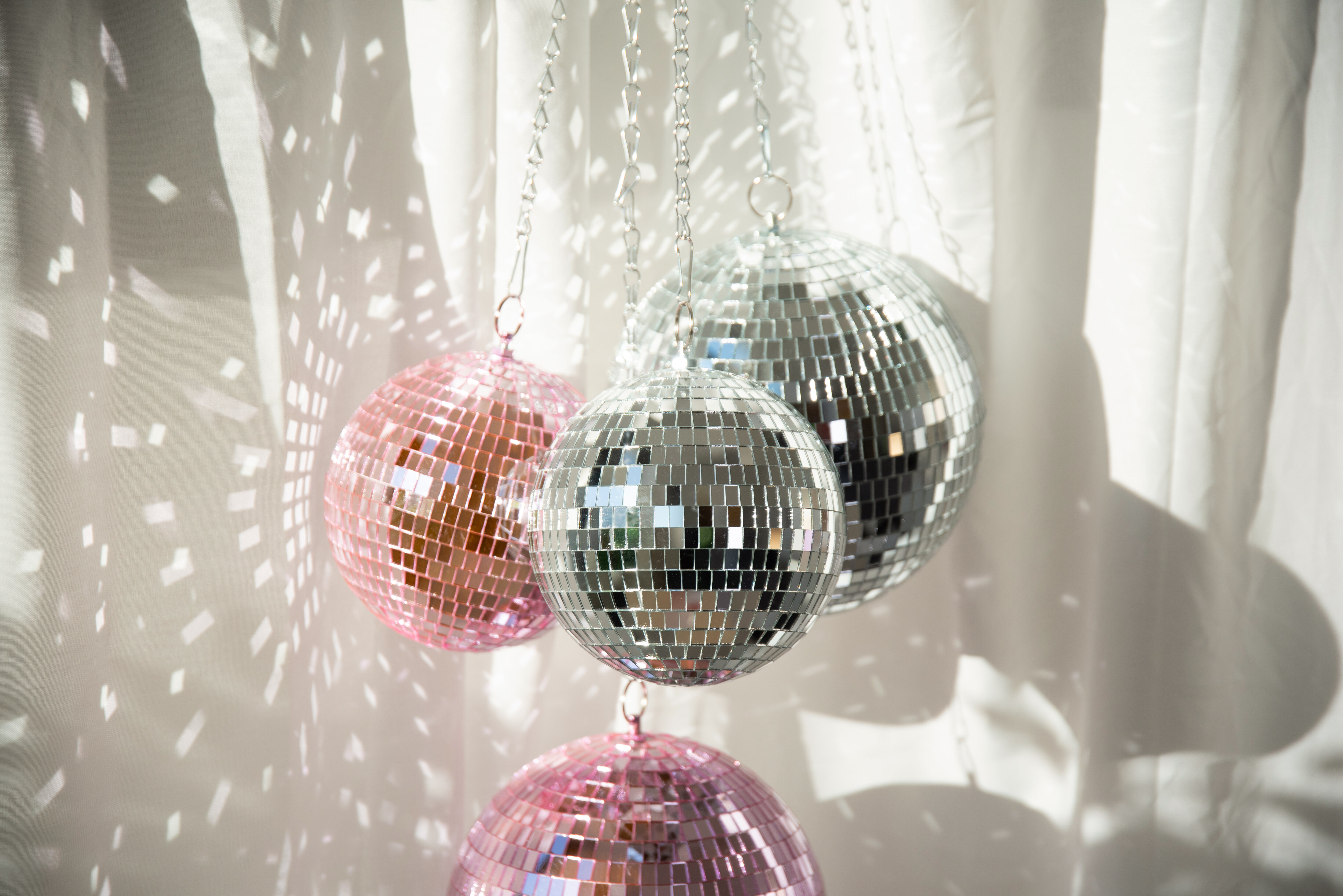 Hanging discoballs in silver and pink.