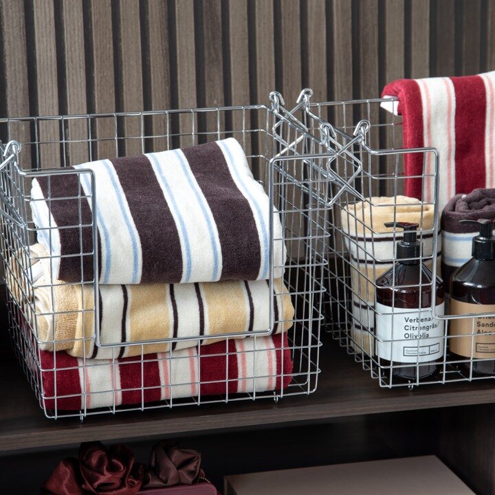 Striped towels and metal storage.