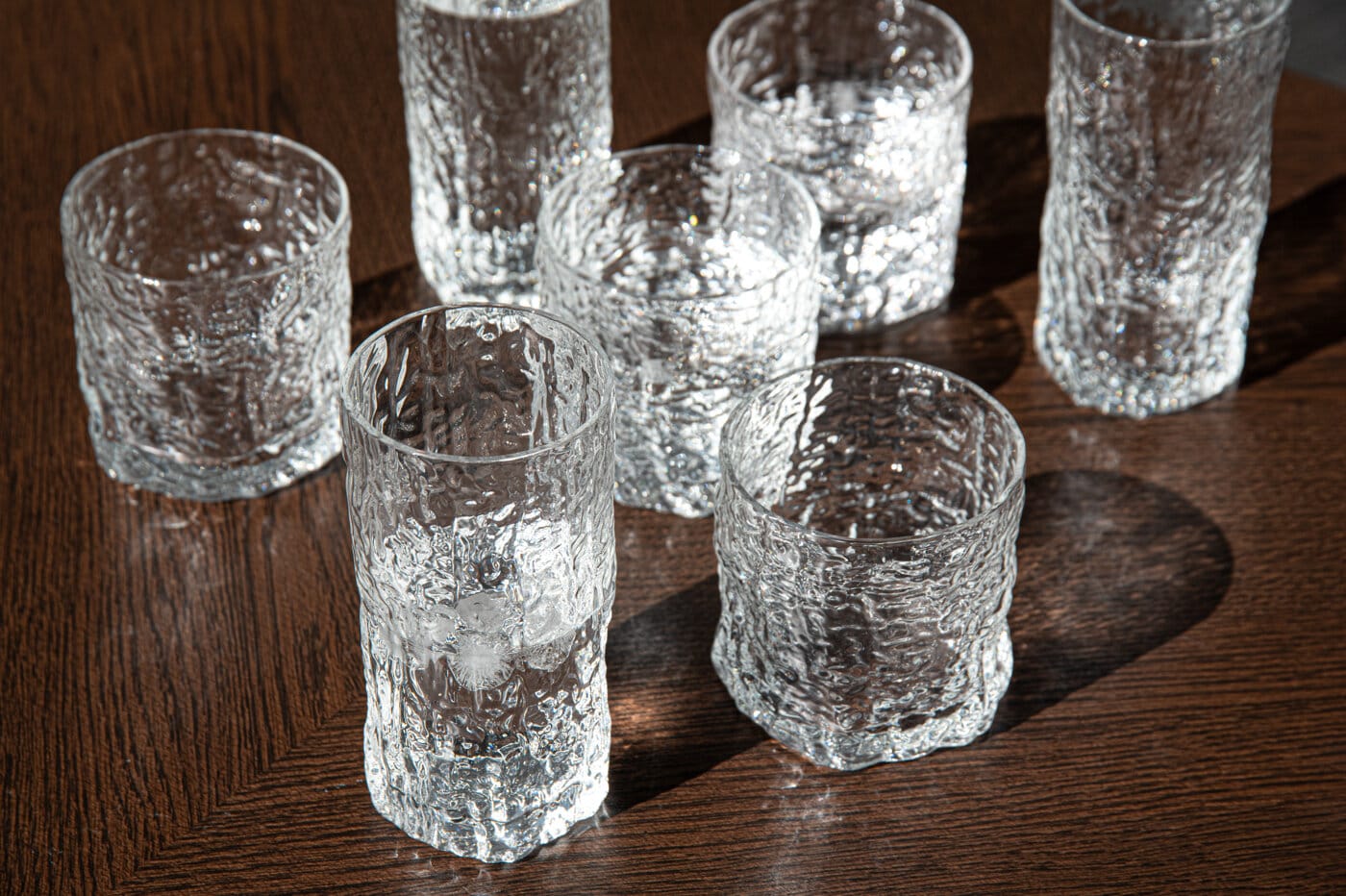 Woods glassware collection with drinking glasses and tumblers in textured clear glass.