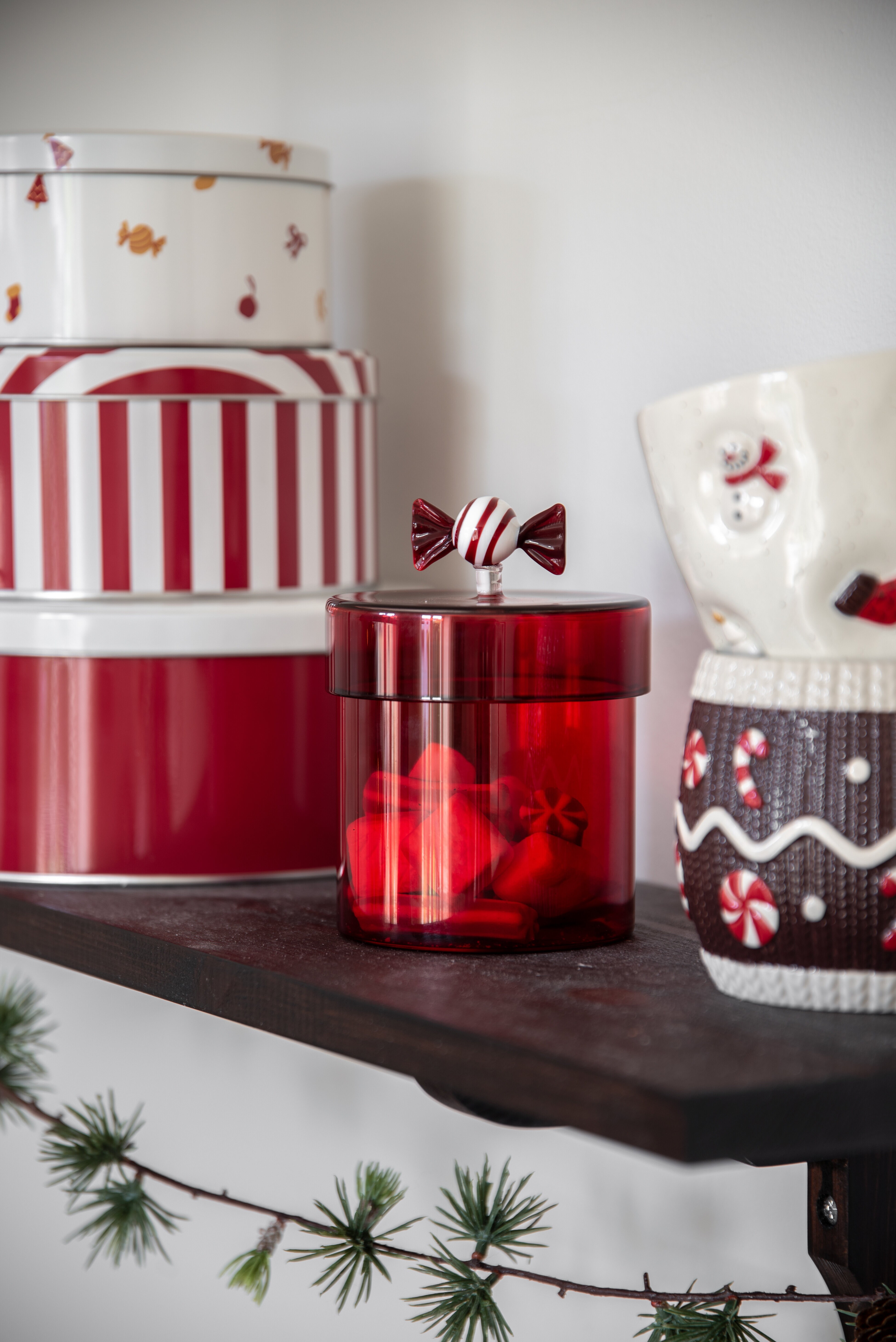 Red Christmas decorations and storage with festive designs.