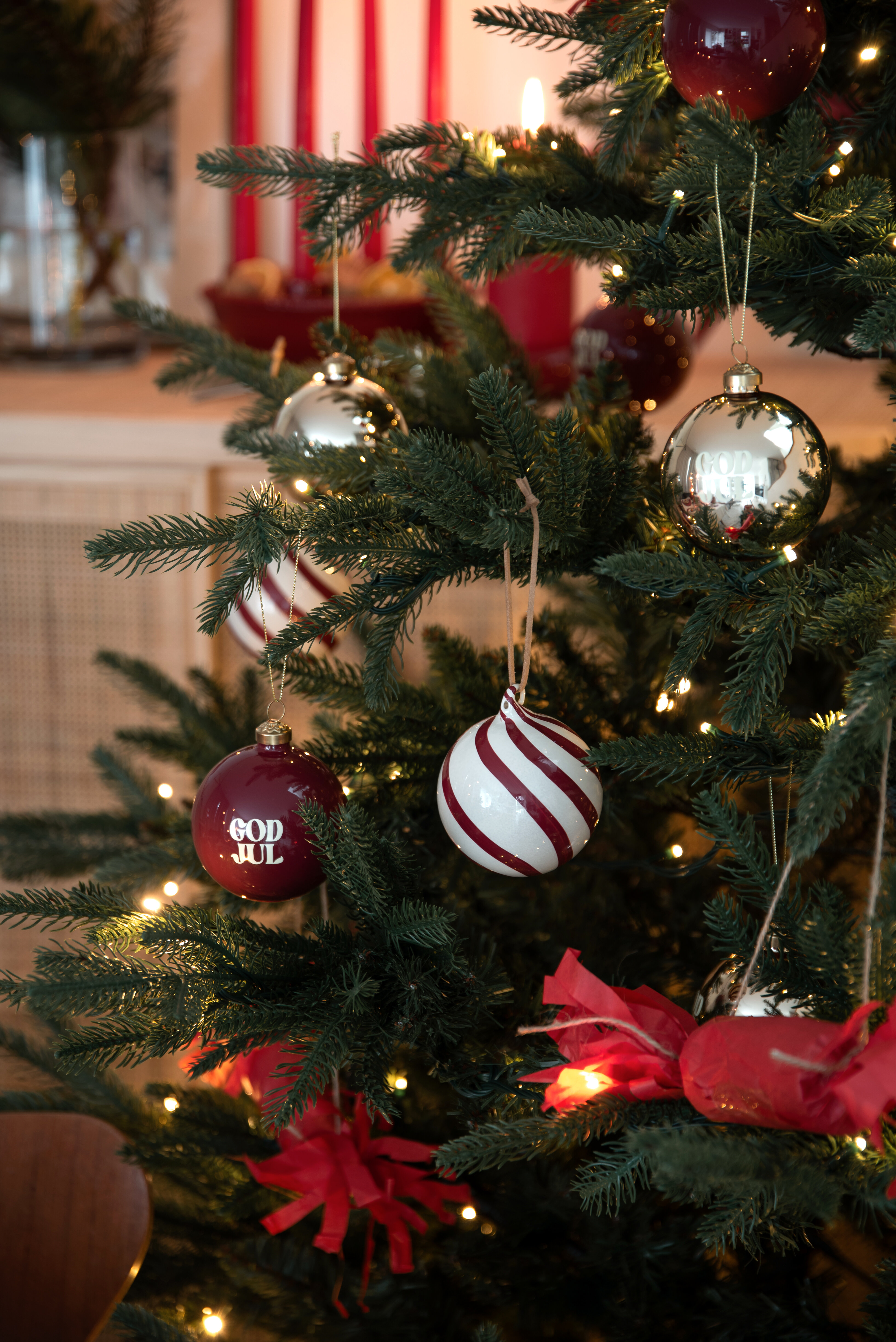 Christmas tree decorated with red and white baubles.