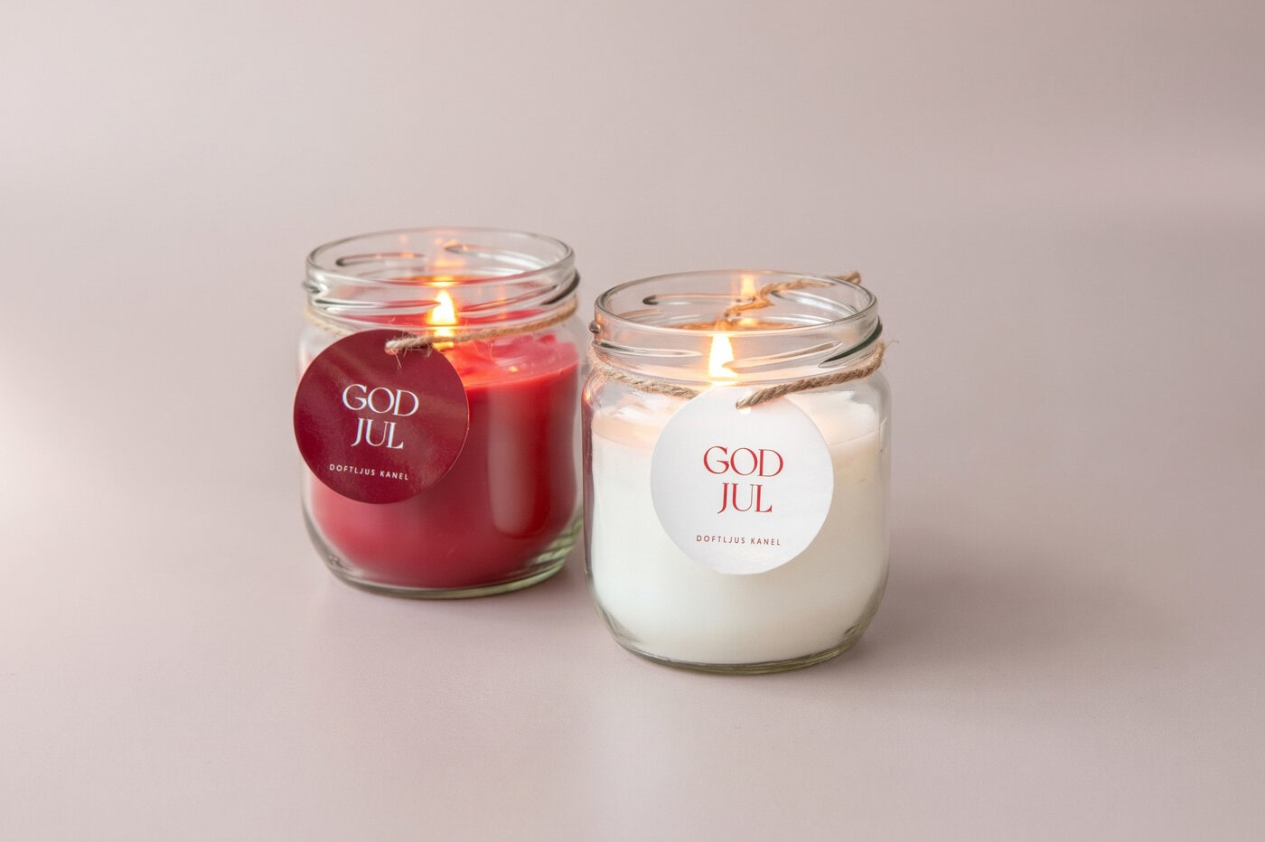 Scented candles in glass jars with hang tag