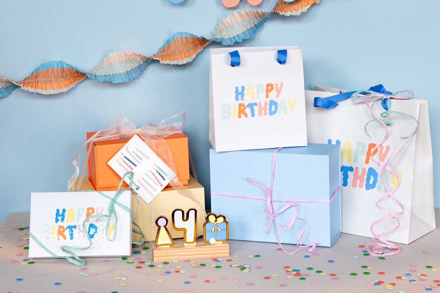 Colourful birthday gifts and gift bags.