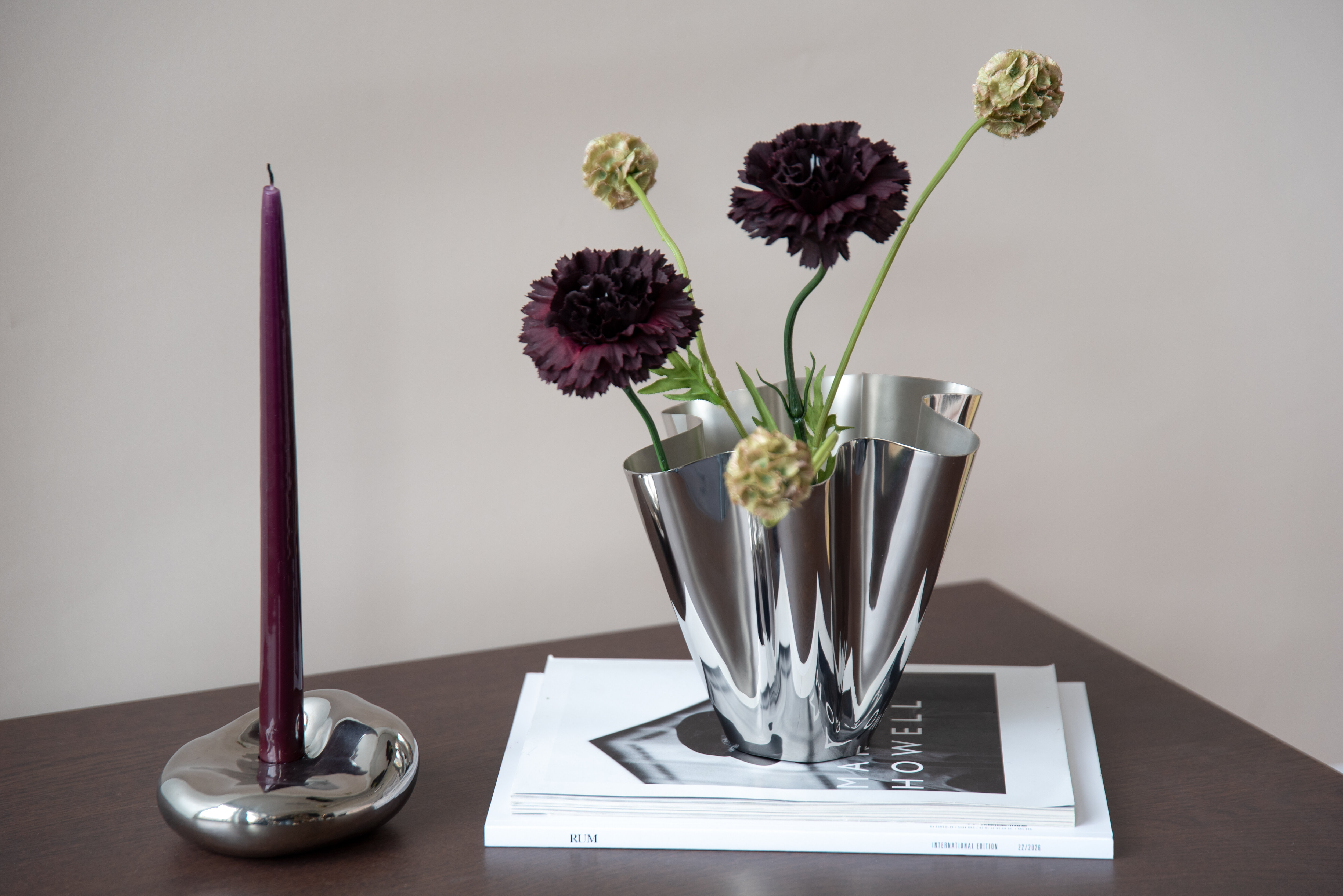 Metallic table lamp standing on a table.