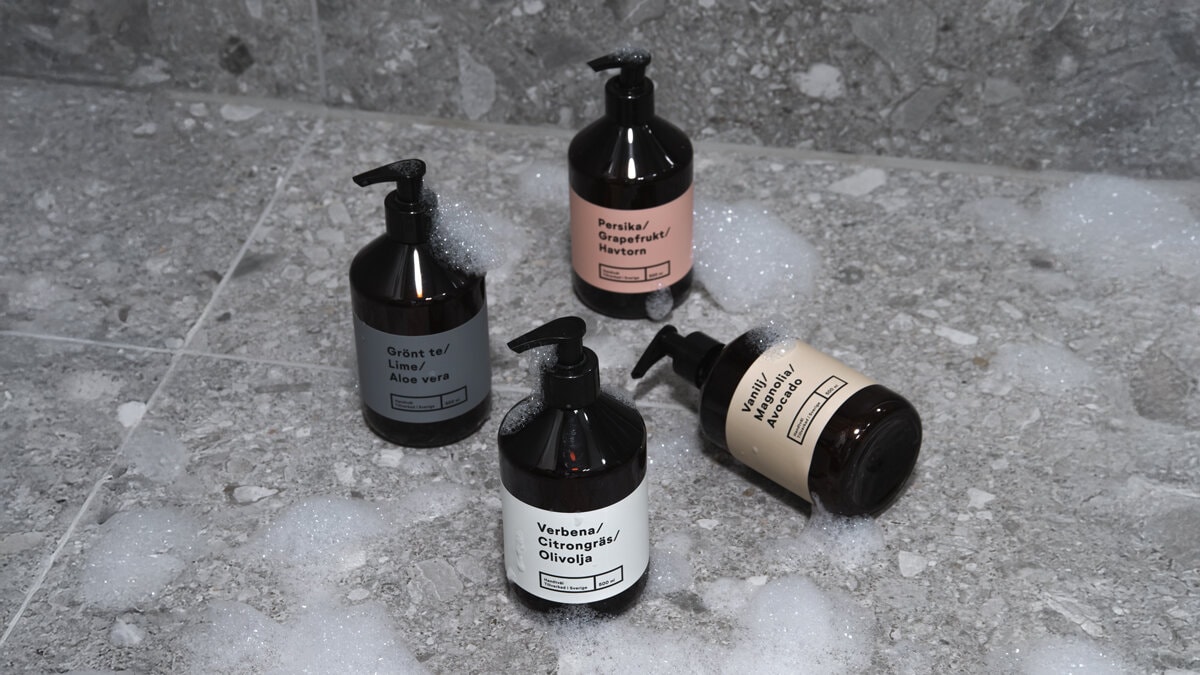 Red and white bow-shaped candle holders with taper candles in different colors.